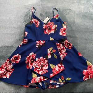 Stillettos brand navy blue floral romper size large